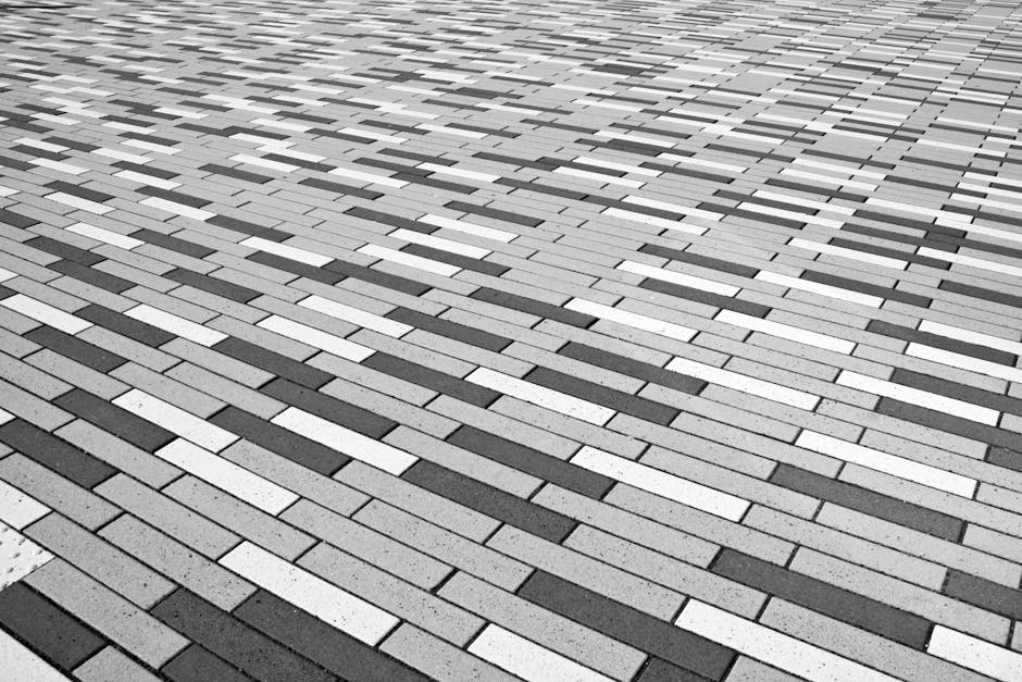 Abstract black and white patterned brick floor provides a geometric visual effect.